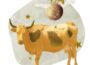 A yellow Taurus cow collage with stars and Mercury with wings